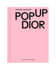 Pink book cover with 'POP UP DIOR' text on a white background