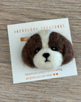 Felted animal head pin on a card with 'Jackelope Treasures' branding on a wooden surface.