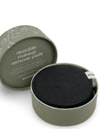 Reusable makeup remover pad in a green container with 'eco' branding.