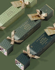 Green boxes with ribbons on a green background