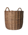 Wicker laundry basket with handles on a light gray background