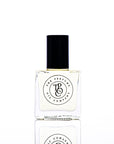 Perfume bottle with black cap and clear label on a white background