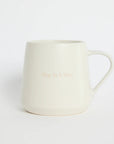 White mug with 'Happy Birthday' text on a white background