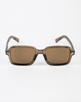 Sunglasses with brown lenses and transparent frame on a white background