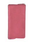 Pink wallet with a visible brand logo on a light gray background