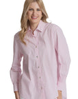 Woman wearing a pink striped shirt against a plain background