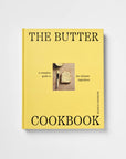 The Butter Cookbook by Sheila Gardner, featuring a bright yellow cover with black text and a small central photograph of a buttered bread slice, shown on a light gray background.