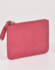 Pink wallet with a zipper on a light gray background