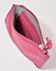 Pink wallet with a zipper on a light gray background