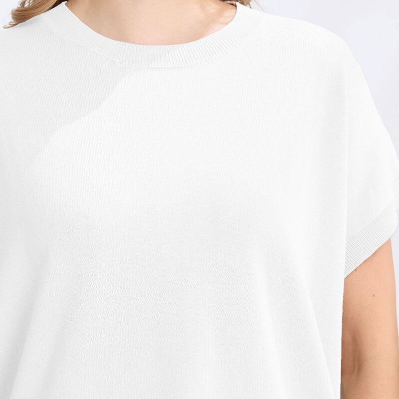 White t-shirt worn by a person on a white background