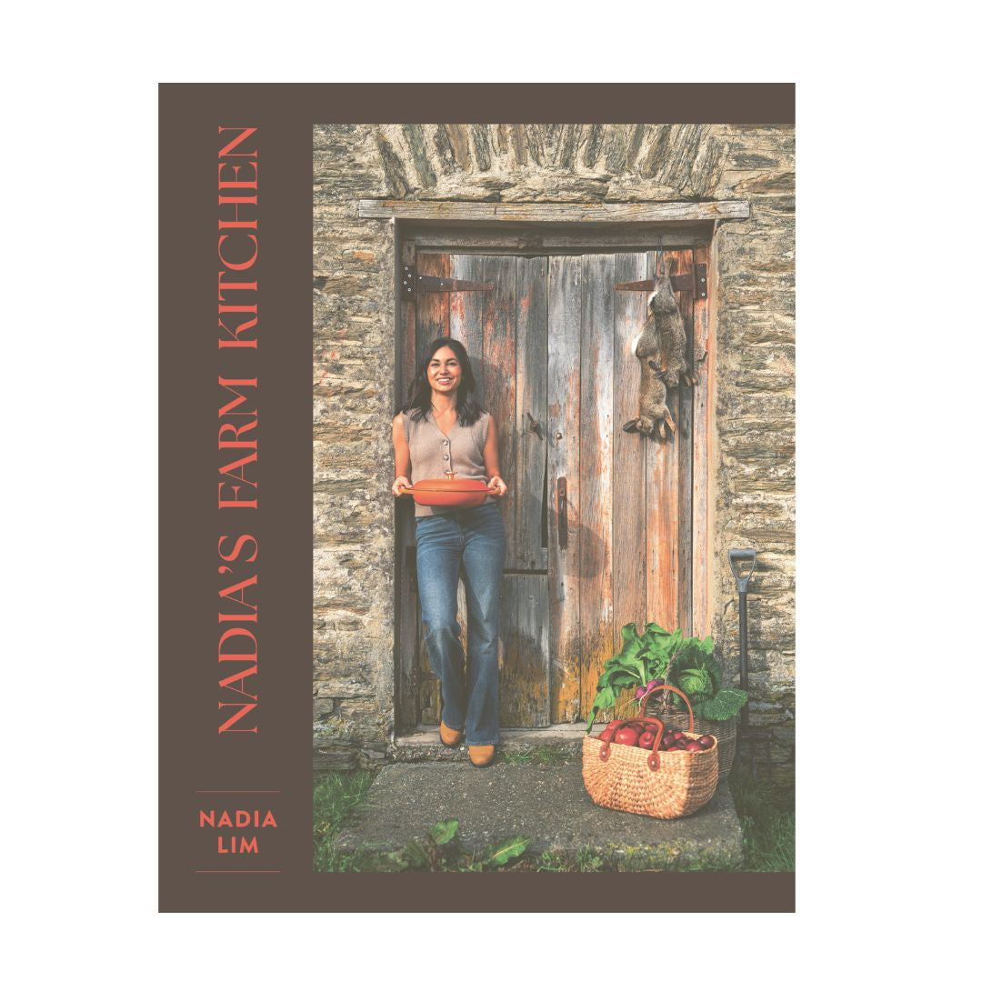 Book cover of 'Nadia's Farm Kitchen' with a woman standing in a doorway with a basket of vegetables.