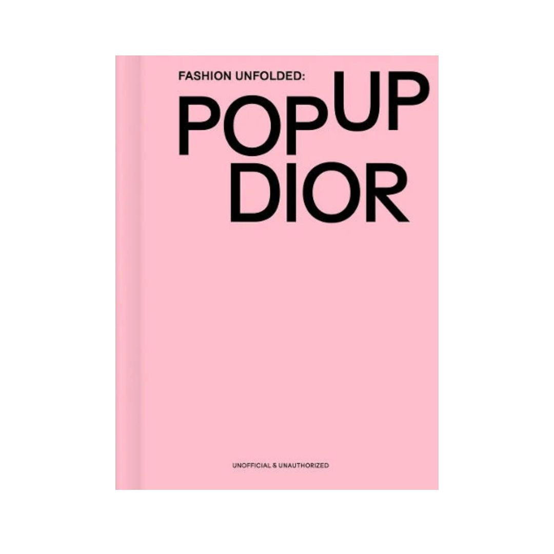 Pink book cover with 'POP UP DIOR' text on a white background