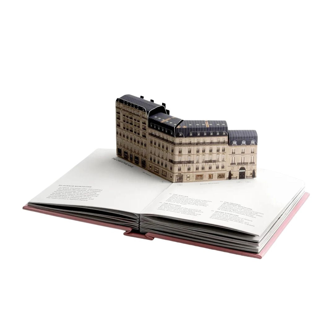 Model of a building on top of an open book