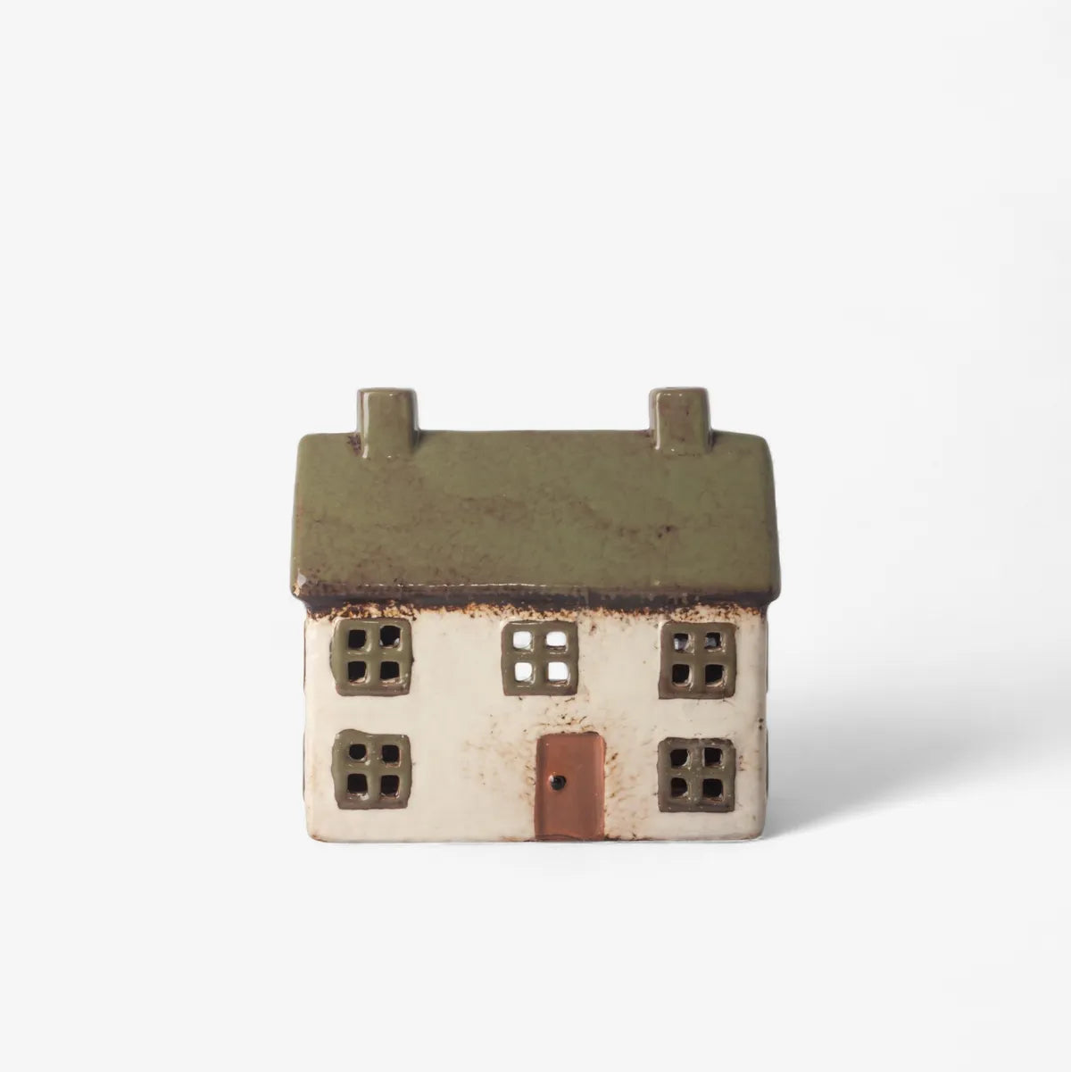 Small ceramic house model on a white background