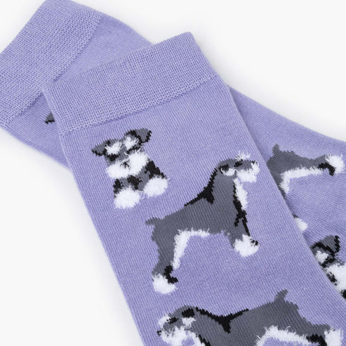 Purple socks with dog pattern on a white background