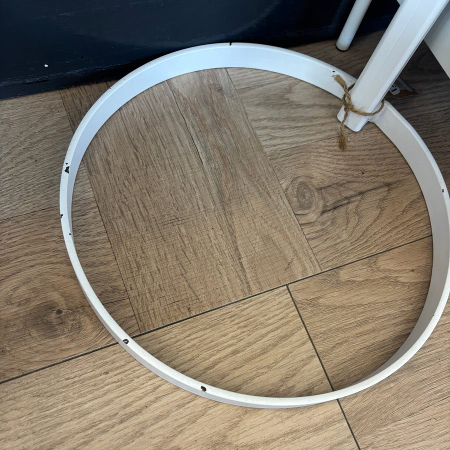 White metal ring on a wooden floor
