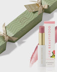 Lák Beautifood lip balm with packaging on a white background