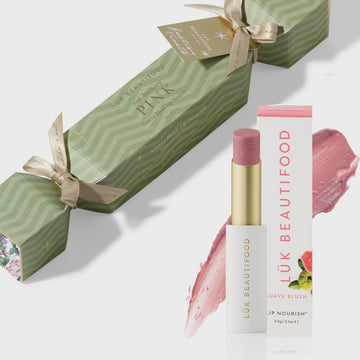 Lák Beautifood lip balm with packaging on a white background