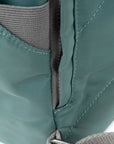 Close-up of teal fabric with gray interior and stitching detail