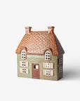 Small model of a house with a tiled roof on a white background