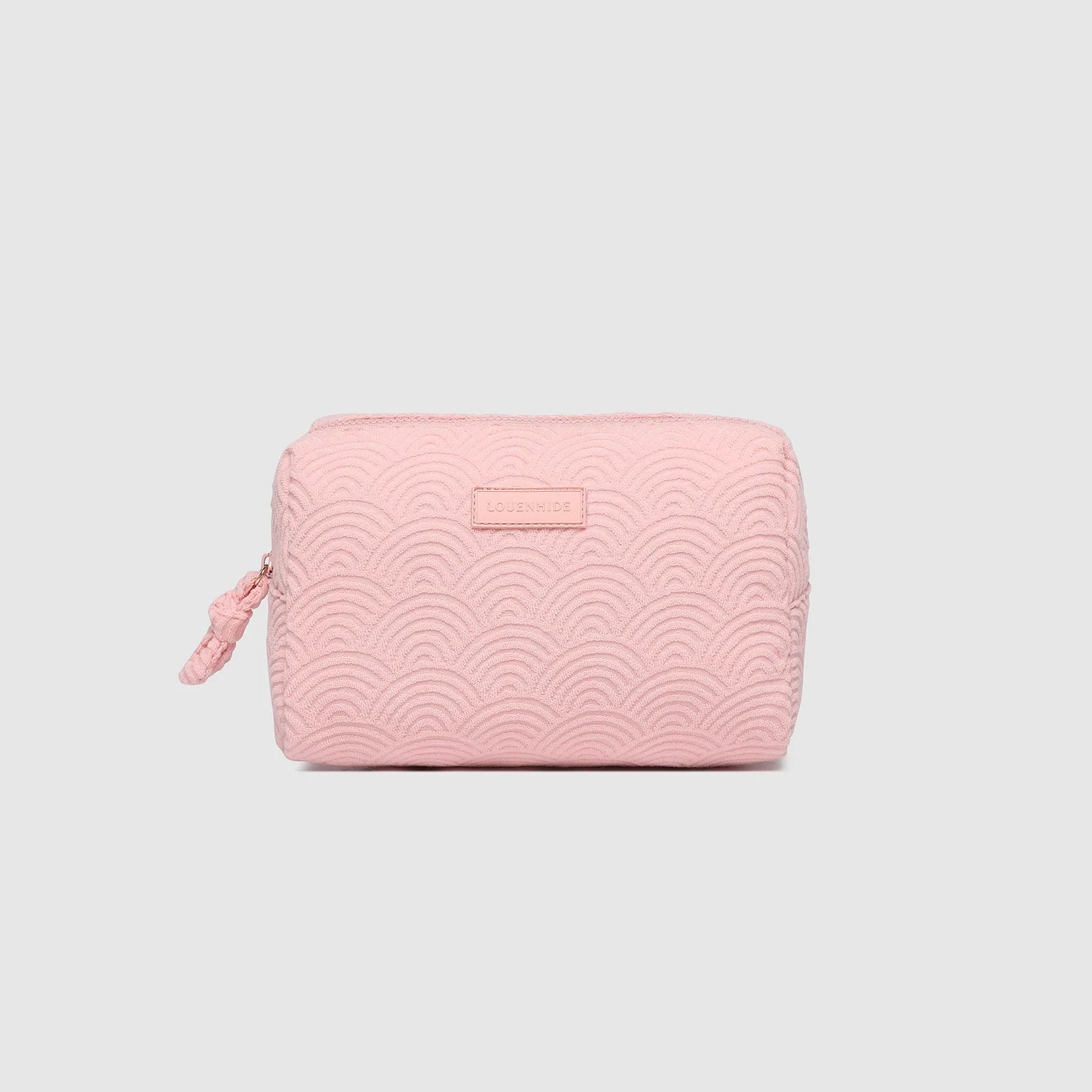 Pink textured pouch on a light gray background