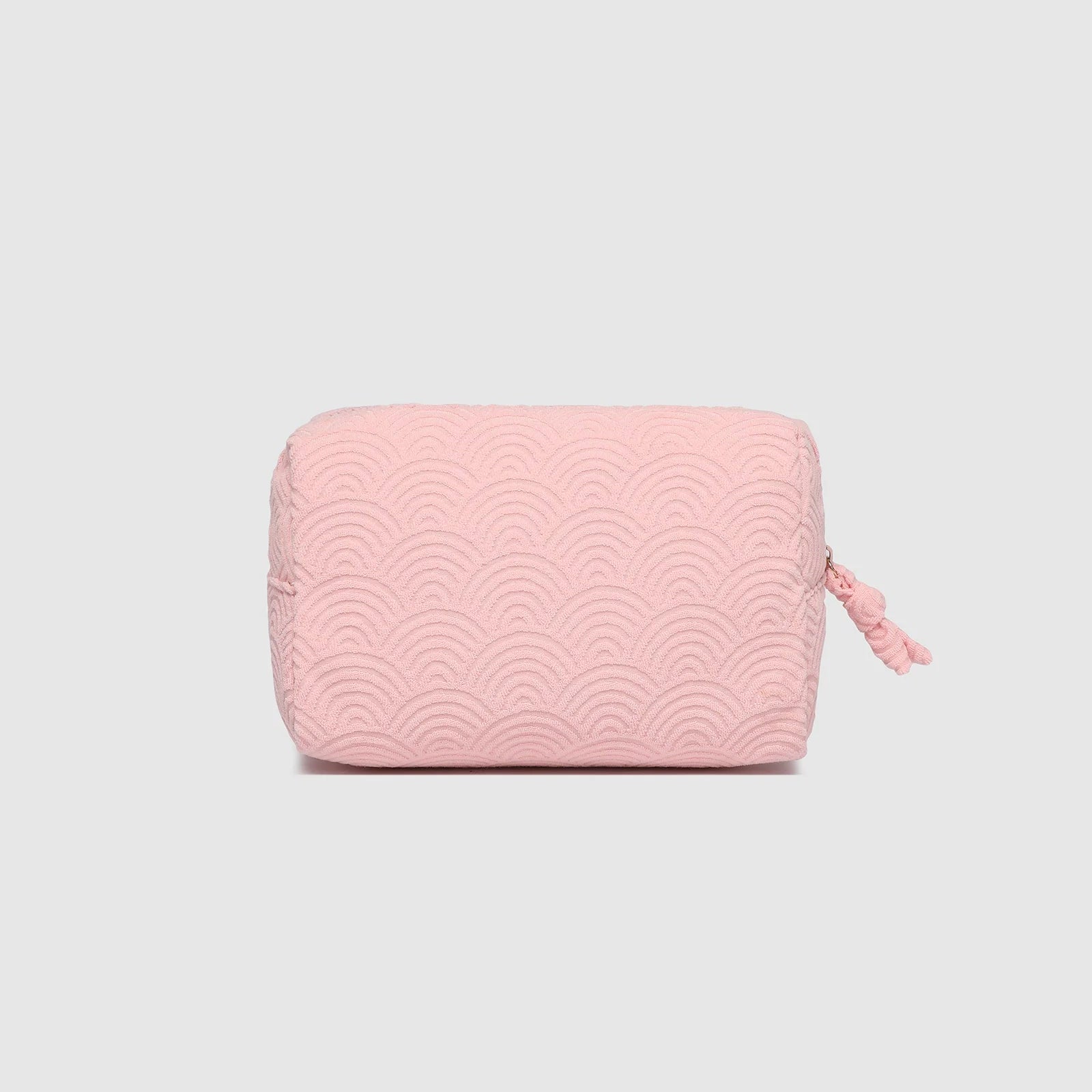 Pink textured pouch on a light gray background