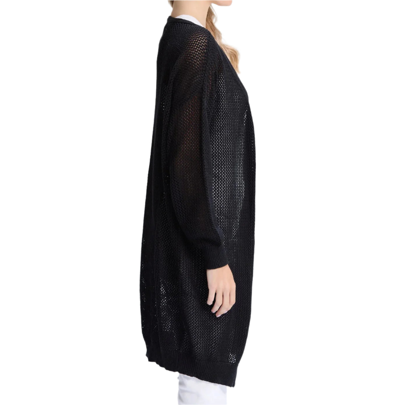 Woman wearing a black mesh dress against a white background