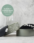 Meditation accessories including a gray headband, eye pillow, and folded blanket on a light surface with 'Clean + Conscious Awards 2026 Finalist' badge.