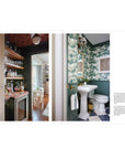 Bathroom interior with green floral wallpaper and white pedestal sink.