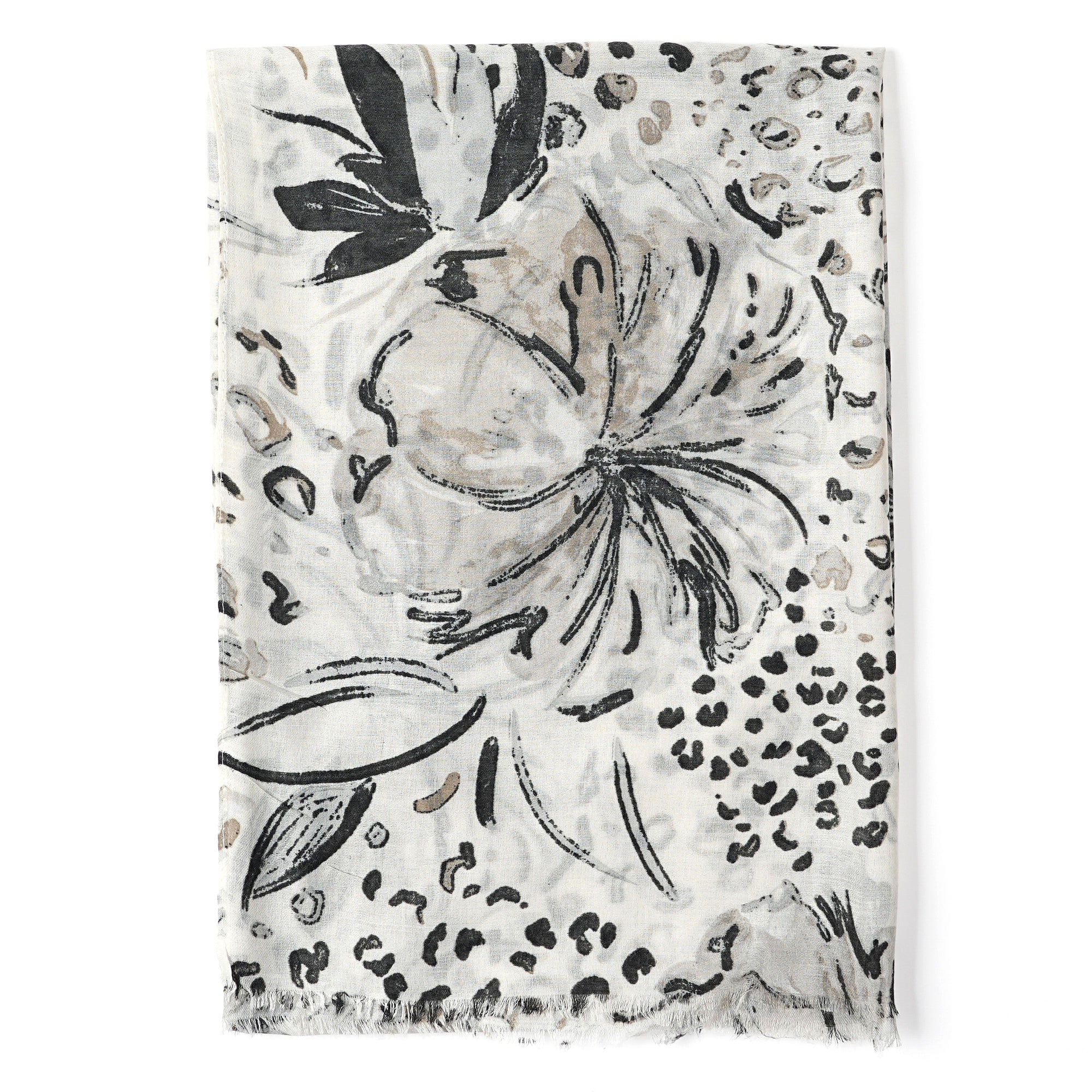 Decorative blanket with floral and leopard print patterns on a white background