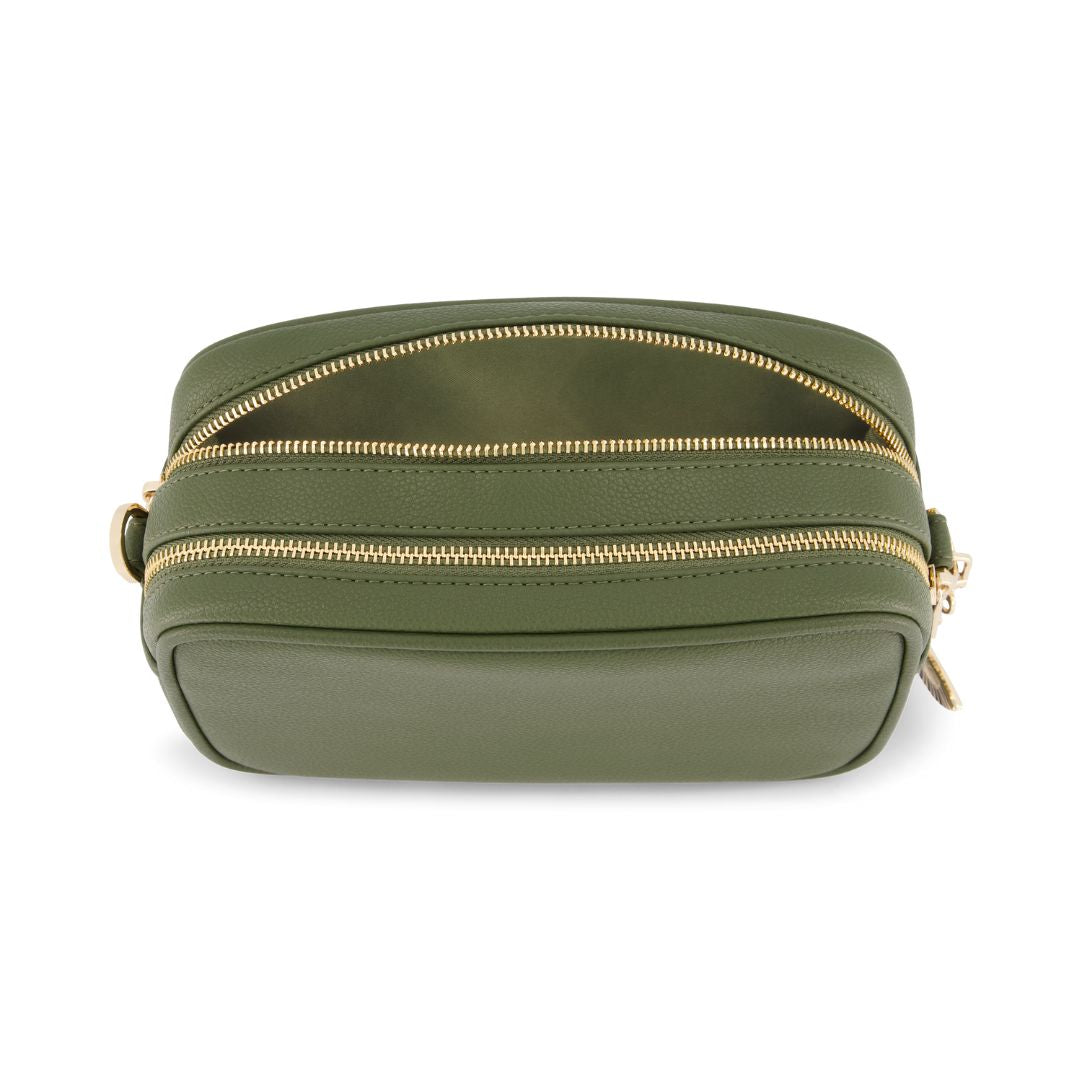 Green leather bag with gold zipper on a white background