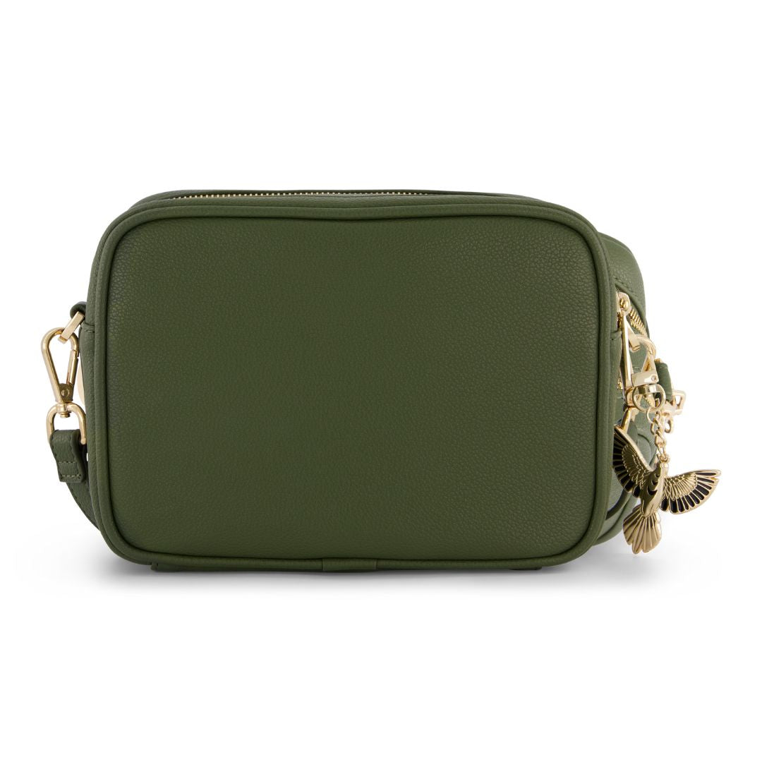 Green crossbody bag with gold accents on a white background