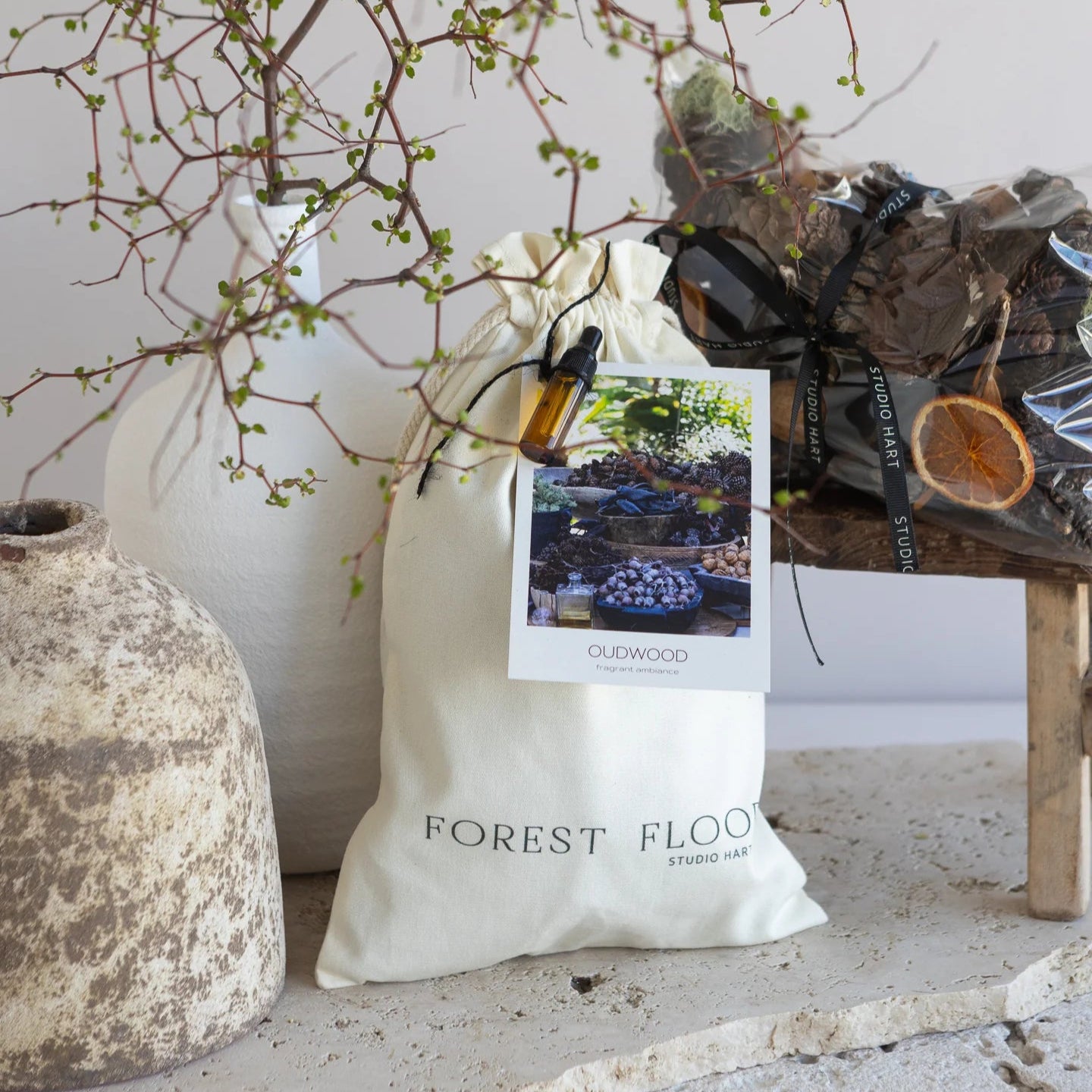 Bag labeled 'Forest Floor' with decorative elements on a neutral background