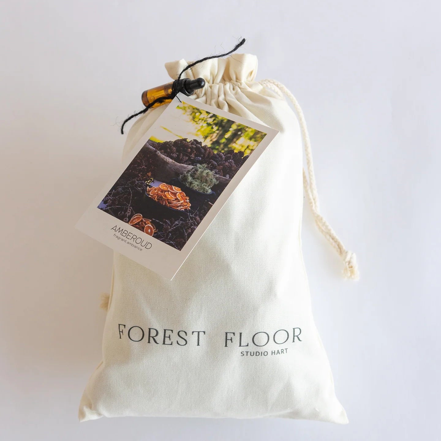White drawstring bag with 'Forest Floor' branding on a white background