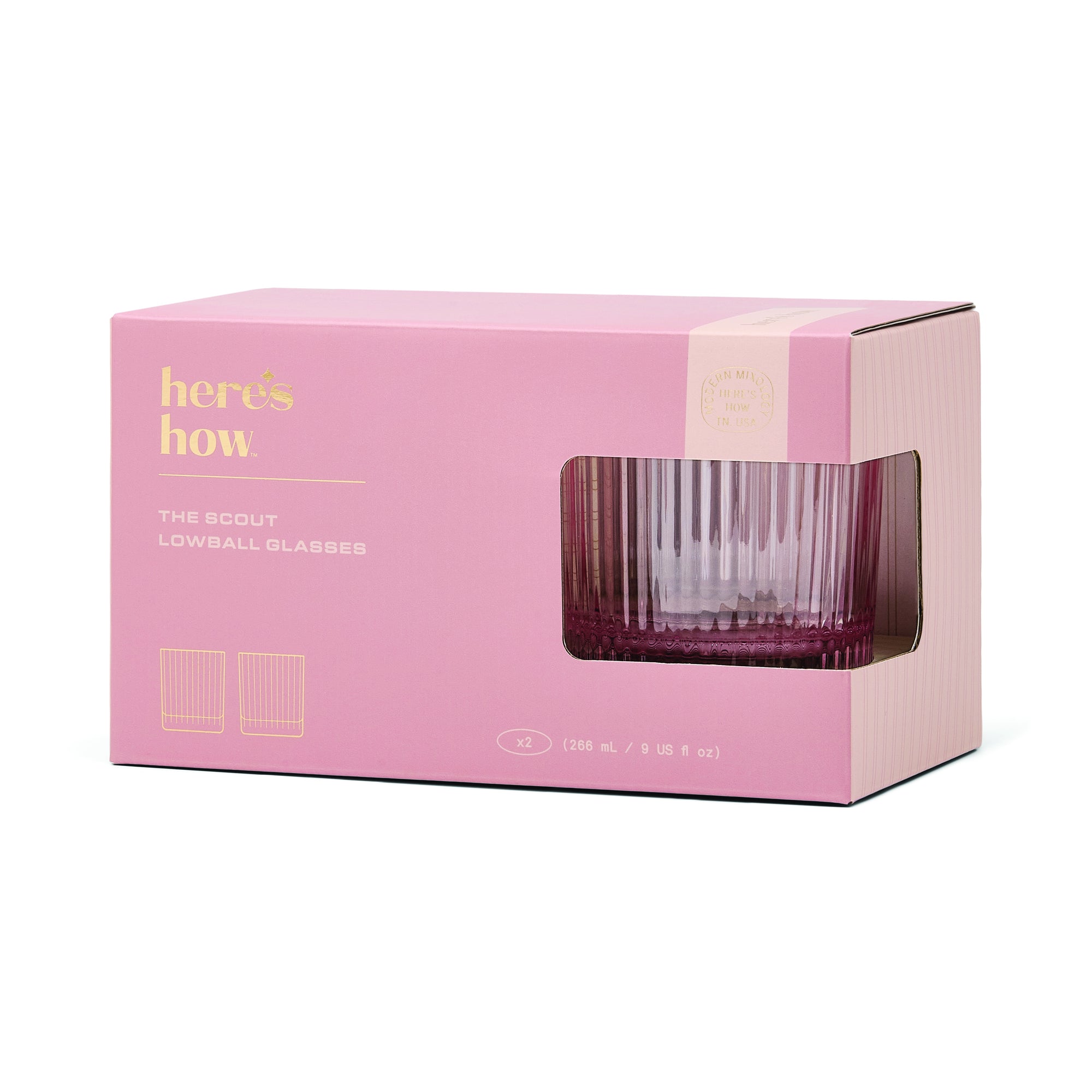 Pink packaging box with a clear glass lowball glass inside, featuring 'here's how' branding.