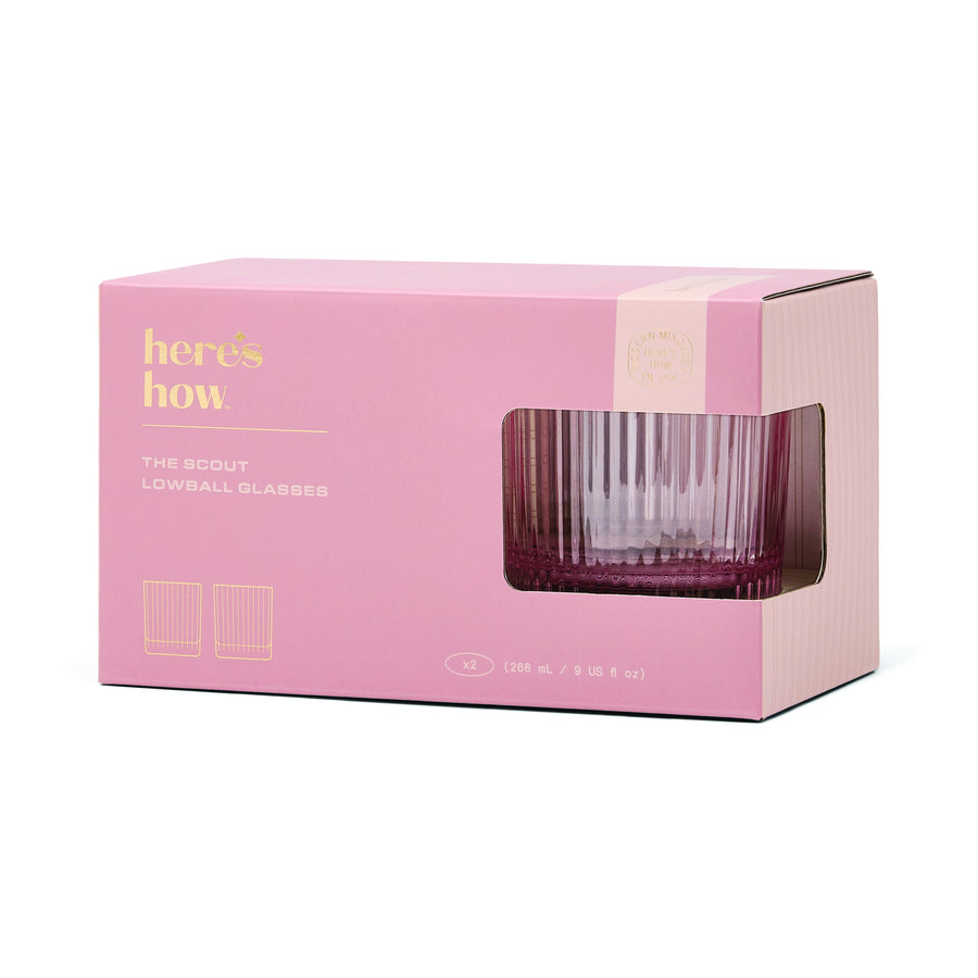 Pink packaging box with a clear glass lowball glass inside, featuring 'here's how' branding.
