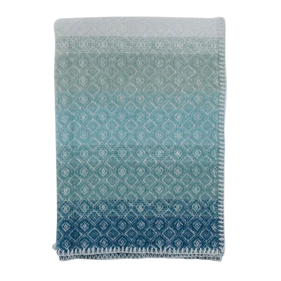 Gradient blue and gray patterned throw blanket on a light gray background