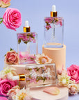 Cosmetic products with flowers on a light purple background

