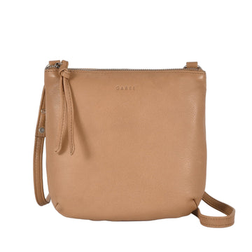 Tan leather handbag with a strap on a white background