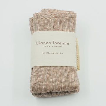 Folded brown fabric with a white label on a white background