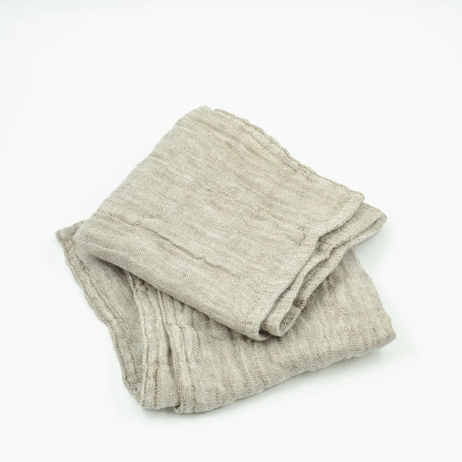 Folded gray sweater on a white background