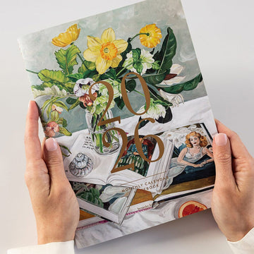 Notebook with floral design and '20' on a white background