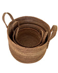 Set of three woven baskets with handles on a white background