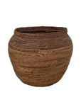 Woven brown basket on a white background