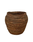 Woven brown basket on a white background