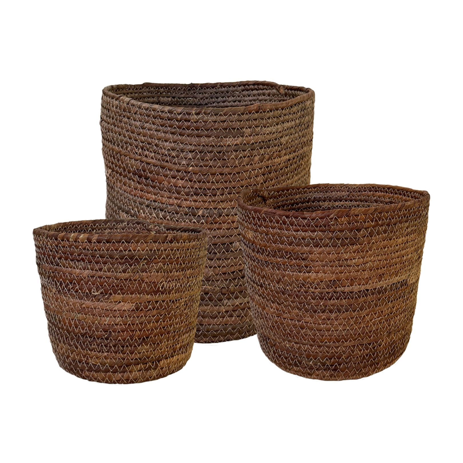 Three woven brown baskets of different sizes on a white background