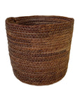 Brown woven basket on a white background