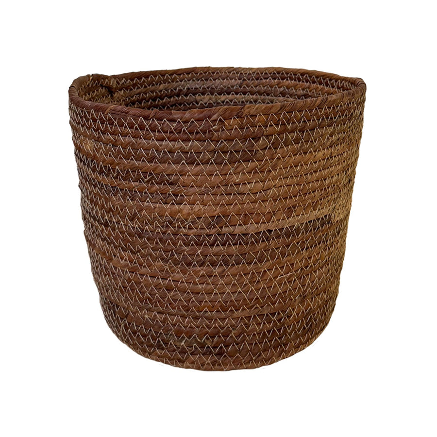 Brown woven basket on a white background