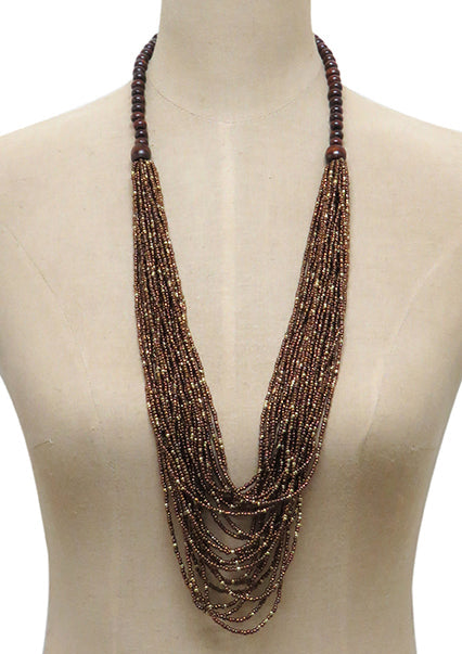 A long multi-strand statement necklace made of dark brown and bronze metallic beads, displayed on a beige mannequin torso against a white background.