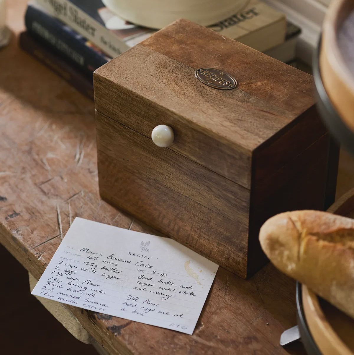 Wooden box with a white label on a rustic wooden surface